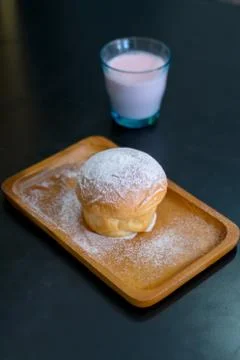 Plain butter bread with icing sugar powder on wooden plate Stock Photos