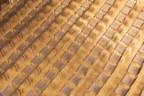 Plain chairs arranging in pattern of line and row Stock Photos