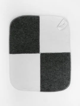 Plain checkered felt seat pad view Stock Photos