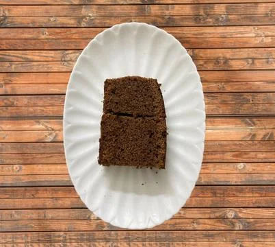 Plain Chocolate Cake double slice being served in a plate Stock Photos