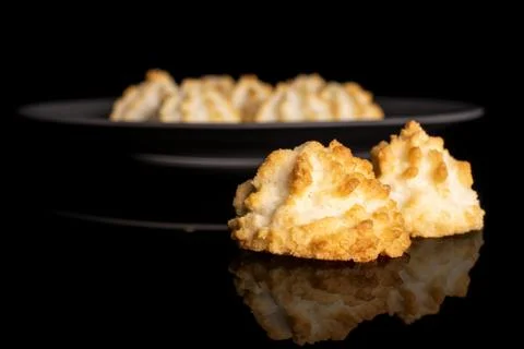 Plain coconut biscuit isolated on black glass Stock Photos