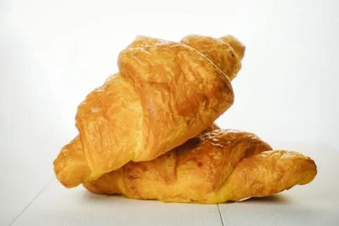 Plain croissant on white background Stock Photos