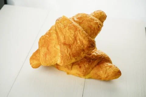 Plain croissant on white background Stock Photos