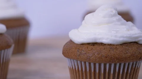 Plain Cupcake Rotating over white background. Cupcake Video stock 128153184