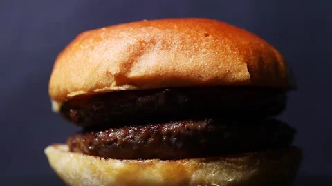 A plain delicious burger rotating video 4k 25fps Stock Footage 256074124