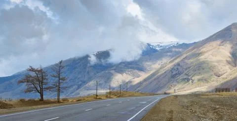Plain at root of mountains Stock Photos