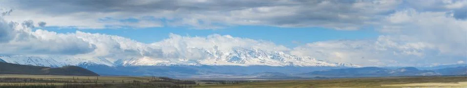 Plain at root of mountains Stock Photos