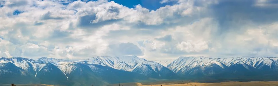 Plain at root of mountains Stock Photos