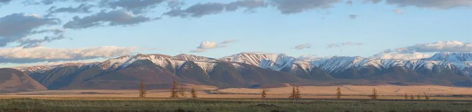 Plain at root of mountains Stock Photos