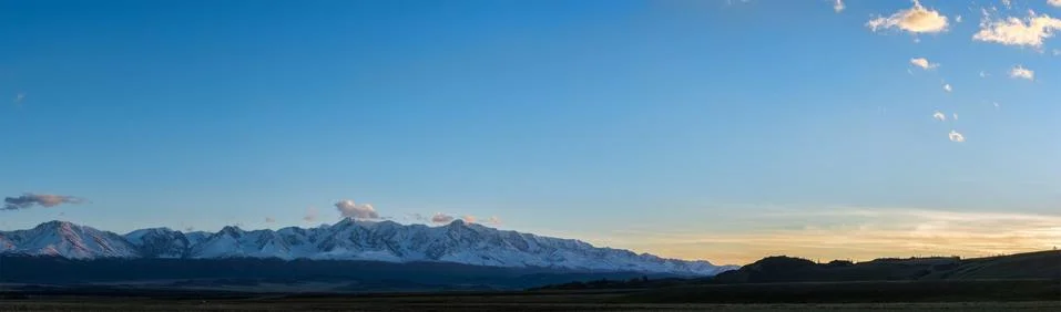 Plain at root of mountains Stock Photos