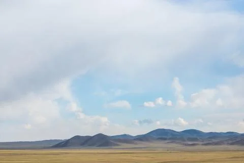 Plain at root of mountains Stock Photos