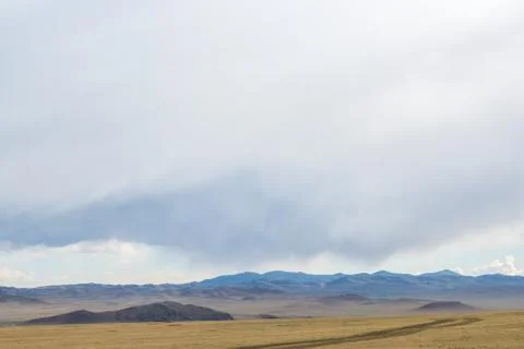 Plain at root of mountains Stock Photos