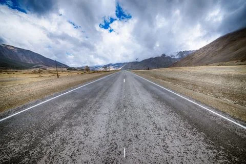 Plain at root of mountains Stock Photos