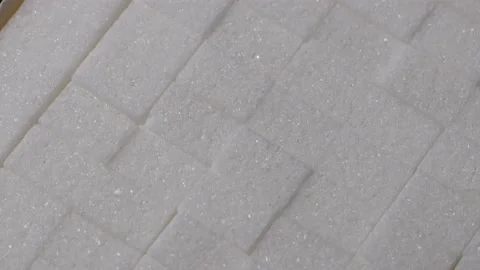 Plain sugar cubes rotating 4k 30fps video Stock Footage 234224996