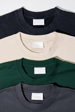 Plain t-shirts assorted colors with blank label. Stock Photos