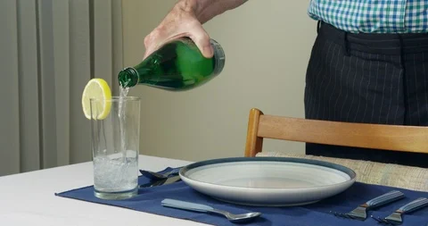 Plain water into empty glass, no ice cubes. Stock Footage 94085773