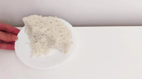 Plain White Rice on Plate Held by Hand- Simple Kitchen Scene Video stock 318868148