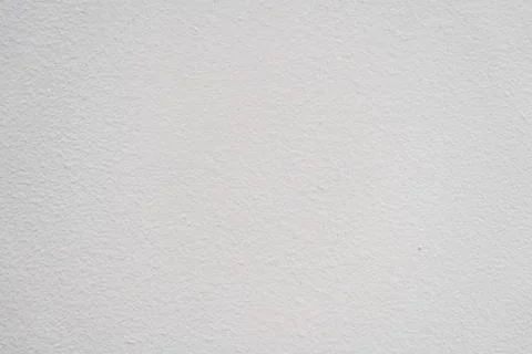 Plain white wall texture with subtle variations in shade, ideal for backgrounds 스톡 사진