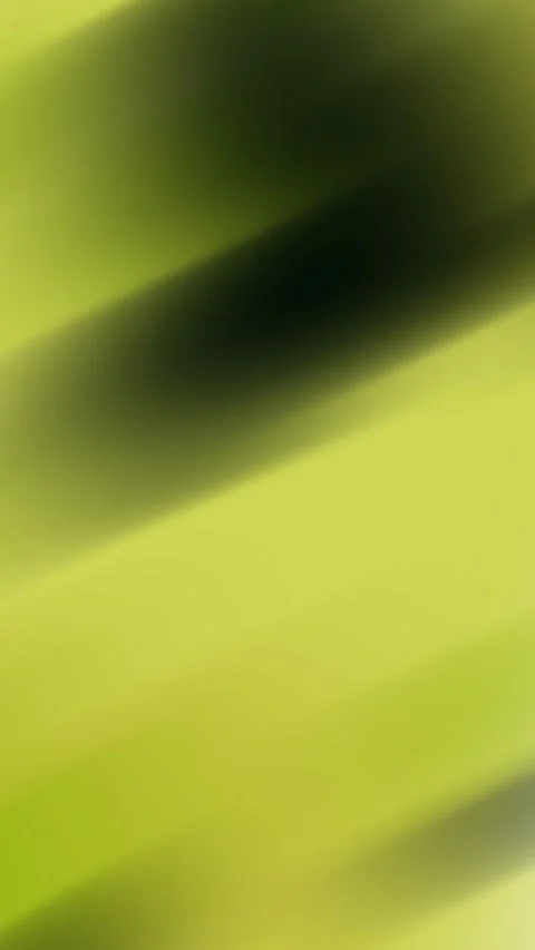 Plain yellow background highlights blurred green and black slanted bands creatin Stock Footage 327631116