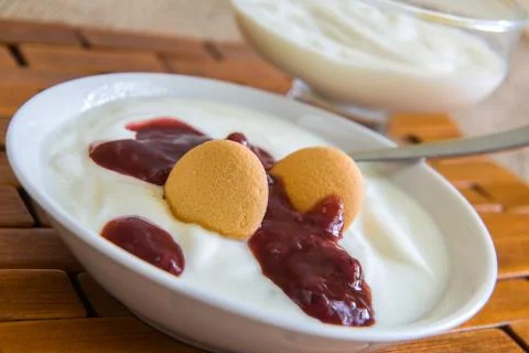 Plain yogurt with soaking the biscuits and jam Фото