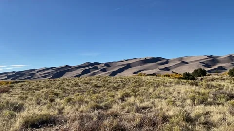 Plains looking out at sand dunes in Colorado Stock Footage 274864933