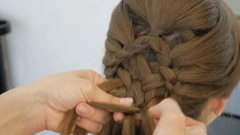 Plaiting braids girl Stock Footage 101308803