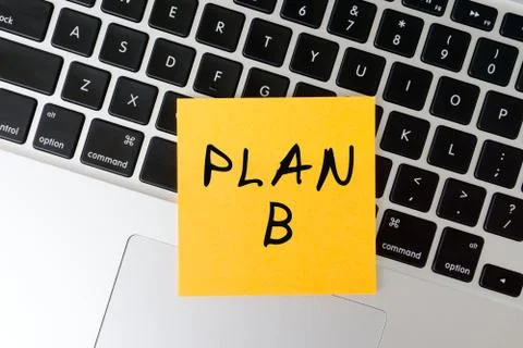 Plan B word written on stick note on top of laptop keyboard Stock Photos