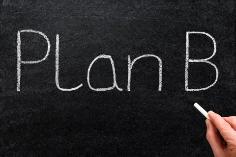 Plan b written with white chalk on a blackboard. 写真素材