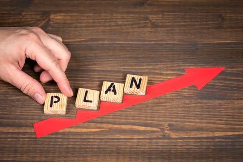 PLAN concept. Red arrow indicates the development and growth. Steps, wooden Stock Photos