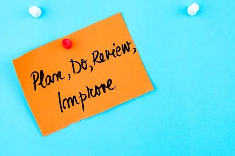 Plan, Do, Review, Improve written on orange paper note Stock Photos