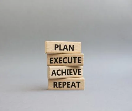 Plan Execute Achieve Repeat symbol. Wooden blocks with words Plan Execute A.. Stock Photos