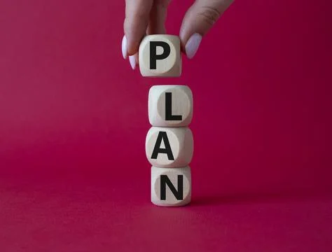 Plan symbol. Concept word Plan on wooden cubes. Businessman hand. Beautiful.. Stock Photos