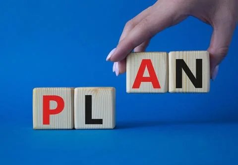 Plan symbol. Concept word Plan on wooden cubes. Businessman hand. Beautiful.. Foto stock