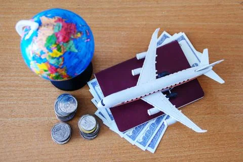 Plan for trip (airplane model and passport) Stock Photos