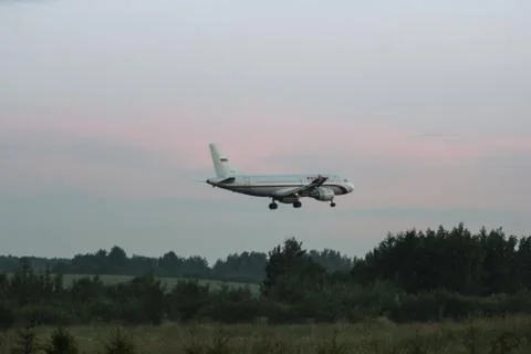The plane is above the ground. Stock Photos