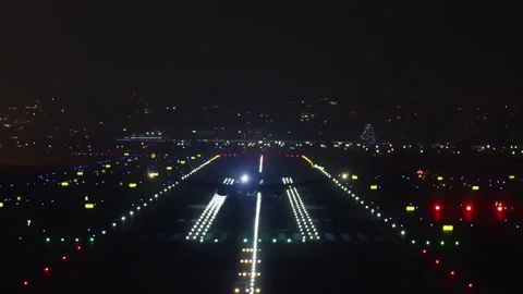 Plane with additional lighting landing over the night city 스톡 동영상 167919605