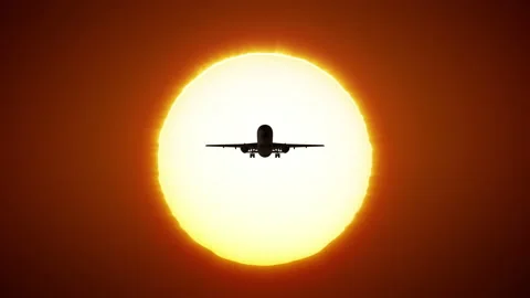 The plane against the background of the disk of the sun. Stock Footage 220706325