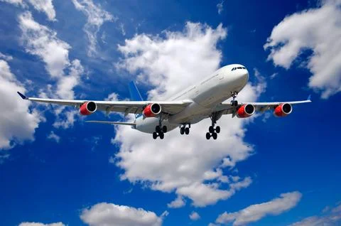 Plane and clouds Stock Photos