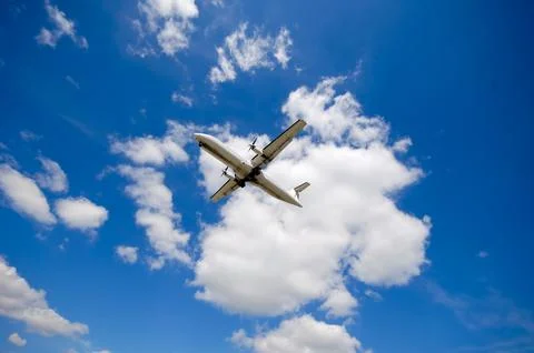 Plane and clouds Stock Photos