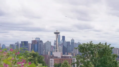 Plane and Helicopter Fly Over Seattle Skyline Near Space Needle Stock Footage 342749512