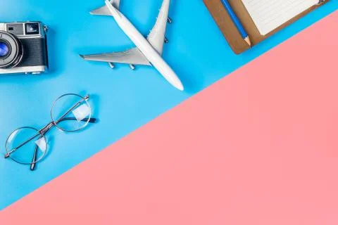 Plane and travel objects on blue and pink copy space Stock Photos