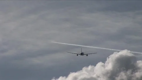 Plane and Vapour Trail Stock Footage 89023229