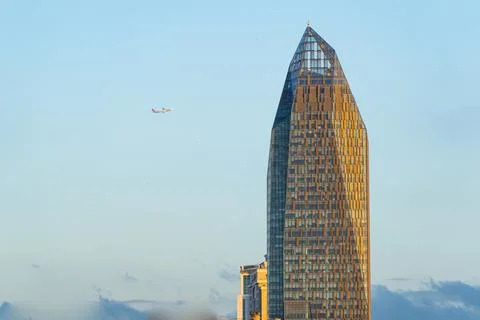 A Plane Aproaching the City Stock Photos