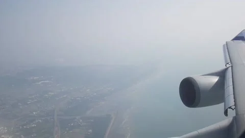 Plane arriving land view from plane's window Stock Footage 164516175