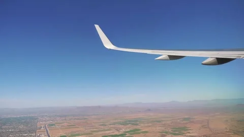 Plane ascending over the rugged desert of the American Southwest in 4k slow Stock Footage 286203896