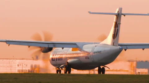 Plane ATR 72 of UTair at sunset Stock Footage 237369371