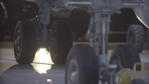 The plane is being prepared for departure, the plane is taken out of the hangar Stock Footage 165249583