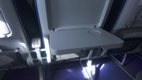 Plane blank tray table Handheld camera parallax movement creating dynamic effect Stock-Footage 328281175