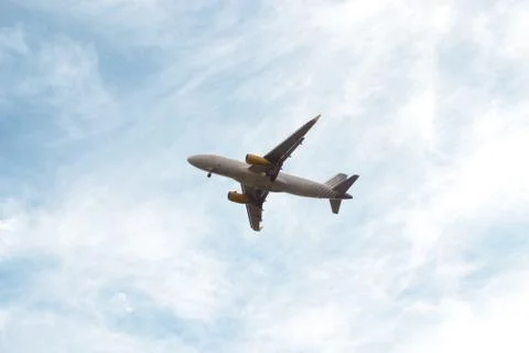 Plane in the blue sky Stock Photos