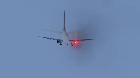 The plane with the burning engine falls into the ocean. Stock-Footage 128954257